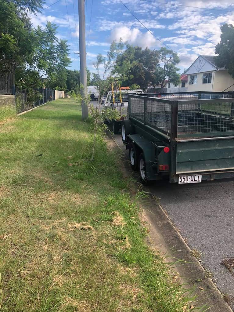 Truck with trailer parked on suburban street